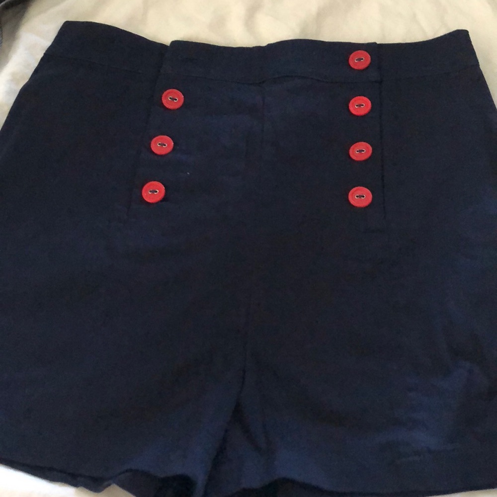 Navy high waisted shorts with red buttons